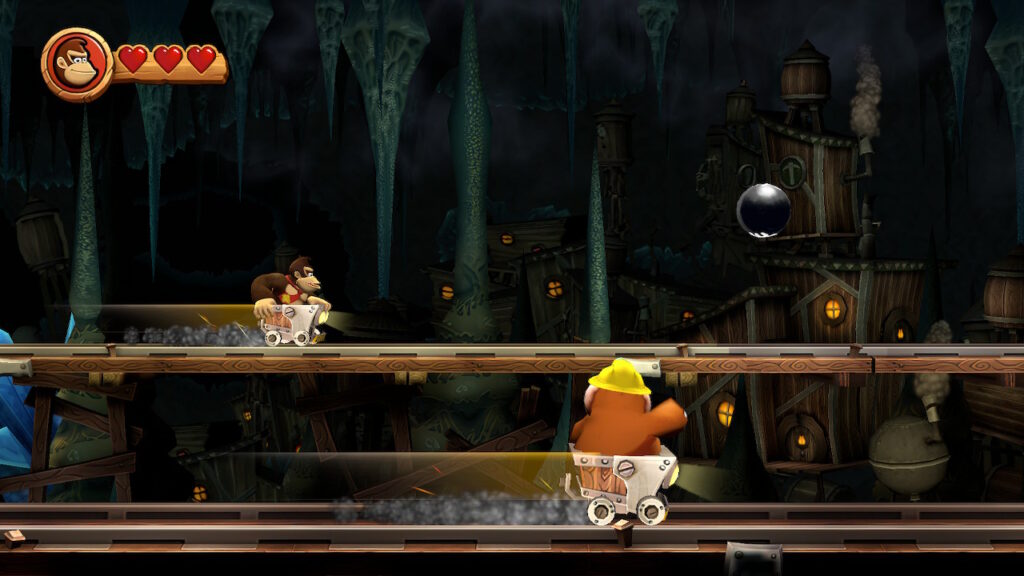 Donkey Kong sur un chariot en arrière plan, une taupe dans un chariot en premier plan dans Donkey Kong Country HD Returns