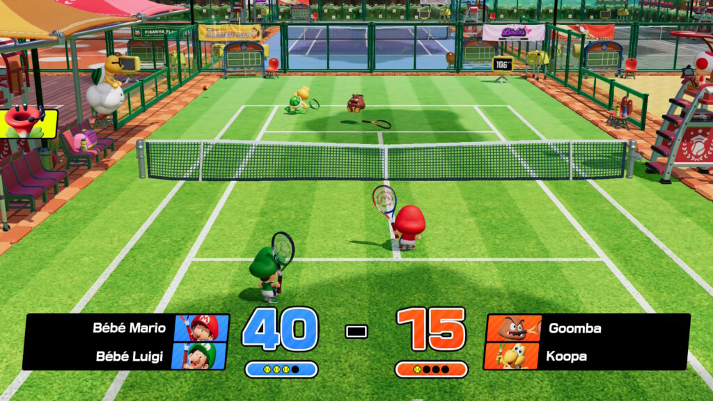 Bébé Mario et Bébé Luigi affrontant en double un Goomba et un Koopa Troopa dans Mario Tennis Fever