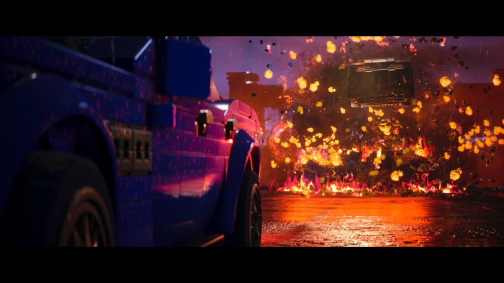 Scène de The Batman ou la Batmobile saute à travers les flammes dans LEGO Batman