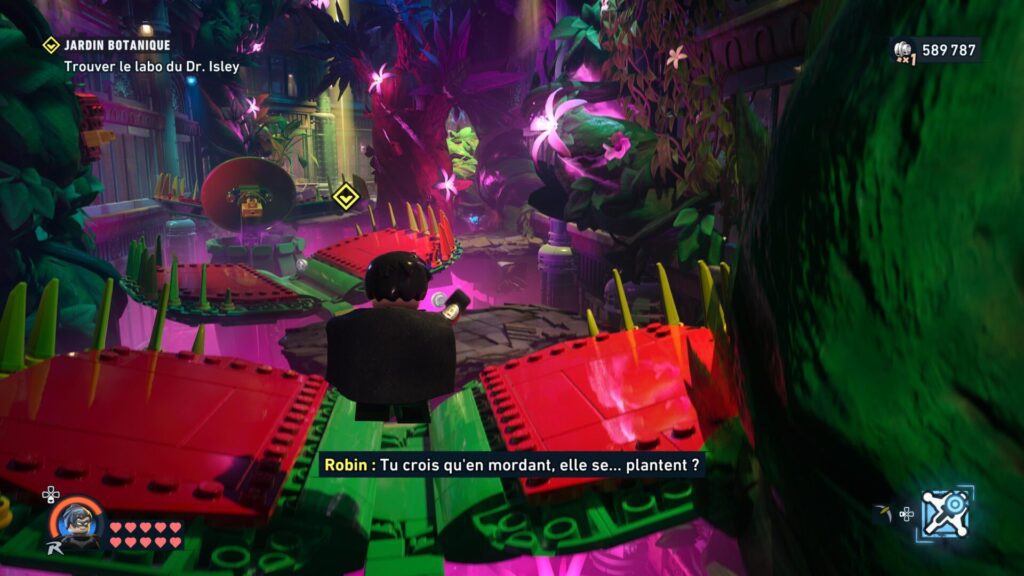 Robin volant au-dessus de plantes carnivores dans LEGO Batman
